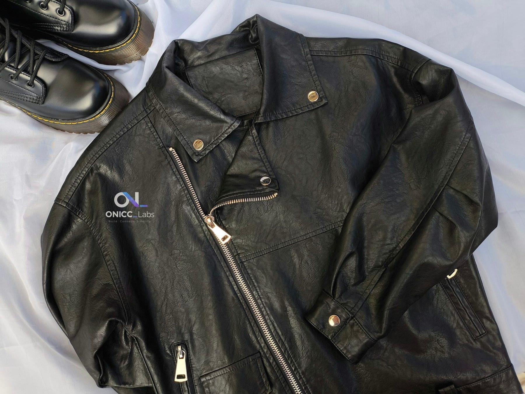 Black leather jacket with a small ONICC Labs logo applied on the left chest